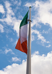 Irish flag in sunny skies 