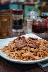  stir-fried rice noodles with beef in a Chinese restaurant