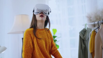 smart casual asian businesswoman attend online virtual meeting presentation new collections cloth fashion set to her worldwide client using virtual reality technology vr headset at home studio daytime