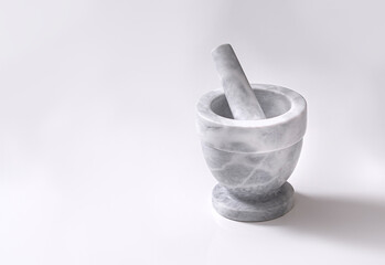 Marble gray mortar for grinding spices on a white background