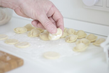Fototapeta na wymiar hands preparing dough for baking