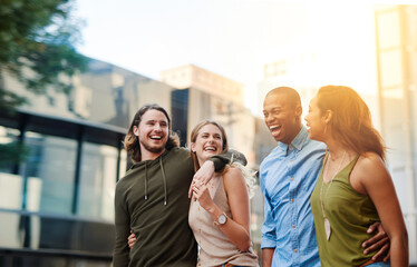 Their favorite couple to hang out with. Shot of two happy young couples taking a walk through the...