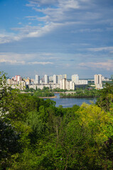 Obraz premium Kyiv, Ukraine May 15, 2021 view of residential buildings on river coast