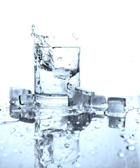 Drinking water splashed with ice in glass
