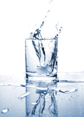 Drinking water splashed with ice in glass