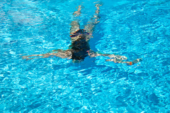 woman swimming under sea water. summer vacation. underwater