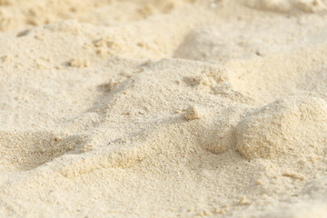 Fototapeta na wymiar Blurred sand background. Dune in the desert. Sand embankment.