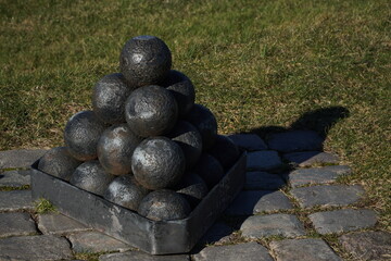 black cannonballs in a pile