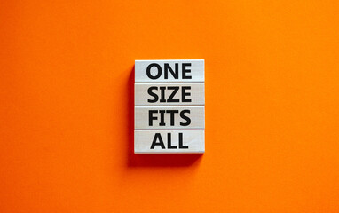 One size fits all symbol. Concept words One size fits all on wooden blocks. Beautiful orange table orange background. One size fits all business concept. Copy space.