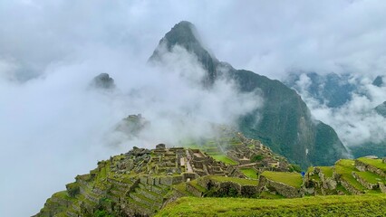 landscape with clouds in the ruins of the ancient city of machu picchu