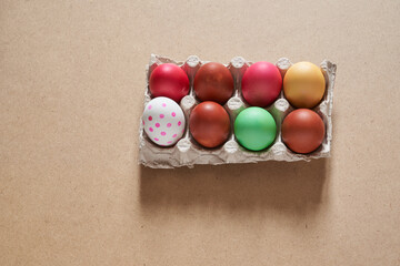 Top view of Easter multicolored eggs in cells. Minimal concept.With a space to copy. High quality photo