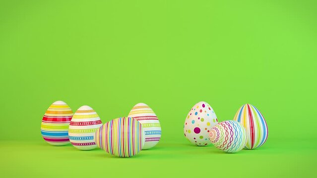 Frohe Ostern - 7 farbenfrohe, bemalte Ostereier auf gr&uuml;nen Hintergrund - Textfreiraum - Oster - Loop