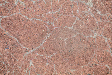 The red wall is old. Crack on a solid wall. Solid material