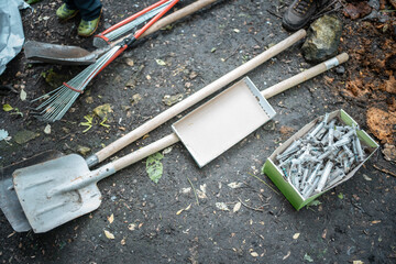 volunteer cleaning up park from used syringe by drug addicted junkies