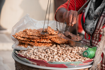 Bangladeshi street peanut bar and nut seller
