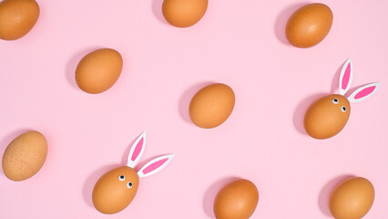 Creative Easter pattern with natural creative eggs on pastel pink background. Flat lay spring concept