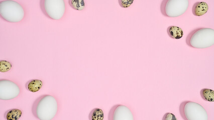 Fototapeta na wymiar Easter frame with copy space on pastel pink background with white and quail eggs. Flat lay minimal concept