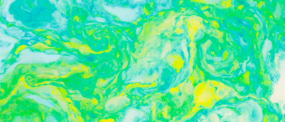 Fluid art creative background. Turquoise yellow spots on liquid. Abstract background with multi-colored stains. Chaos concept