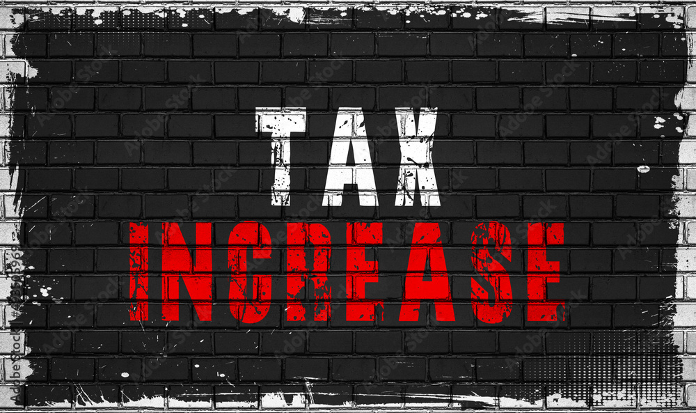 Wall mural tax increase concept on black wall 