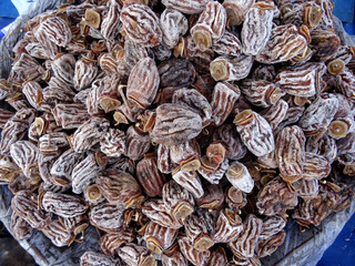 Dried persimmons on a farmers market stall in Yalikavak, Bodrum, Turkey.        
