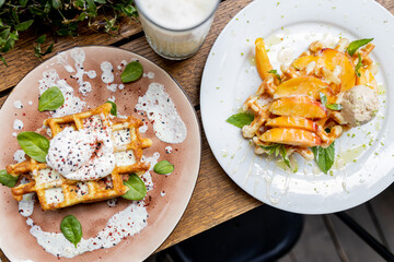 Waffles breakfast with fruit and vegetables omelet camembert