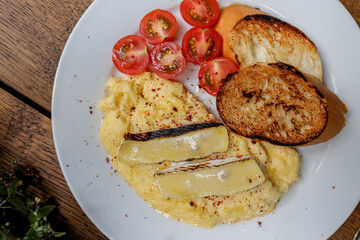 Waffles breakfast with fruit and vegetables omelet camembert