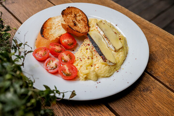 Waffles breakfast with fruit and vegetables omelet camembert