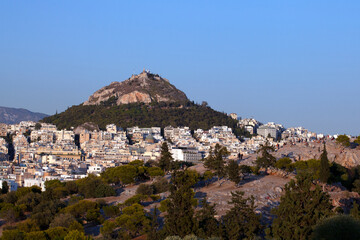 Fototapeta na wymiar colourful buildings around Lycabettus hill in Athens, Greece. Sunny afternoon