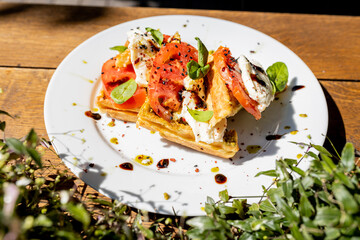 Waffles breakfast with fruit and vegetables omelet camembert