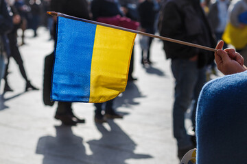 flags and symbols at a peaceful protest in defense of Ukraine