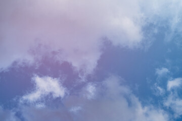 Bottom up view of summer blue cloudy sky.