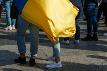 flags and symbols at a peaceful protest in defense of Ukraine