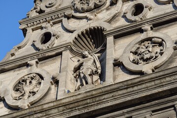 LVIV, UKRAINE - February 2022: SHIELD-PEDIMENT of The Bernardine church and monastery, today the Greek Catholic church of St. Andrew with sculptures.