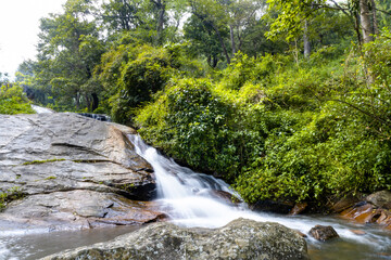 Waterfall in the forest . Autumn nature