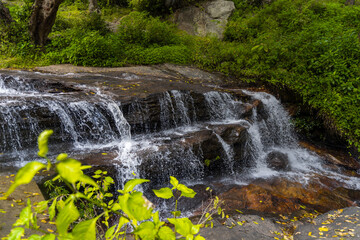 Waterfall in the forest . Autumn nature