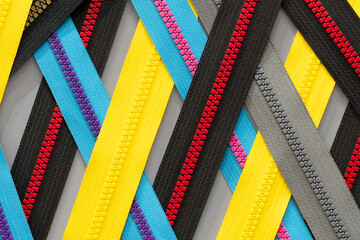 Multicolored Zippers or Zip Fasteners used for binding fabric or textile. Colorful Clasp Lockers...