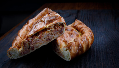 Village meat pie. Two pieces of homemade pie.