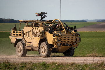 British army Supacat Jackal 4x4 rapid assault, fire support and reconnaissance vehicle in action...