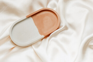 Gypsum marble decorative stand on the background of silk stand.