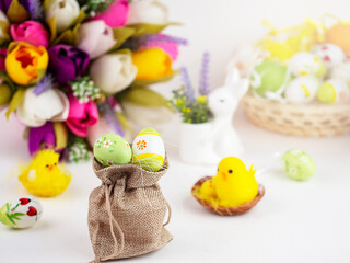 Bright Easter card with colorful eggs, funny chickens, flowers and other elements. Bright colorful festive background.