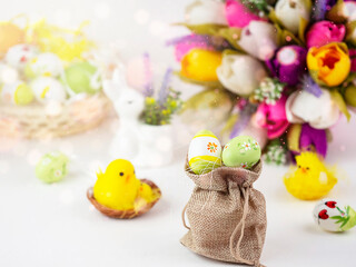 Bright Easter card with colorful eggs, funny chickens, flowers and other elements. Bright colorful festive background.