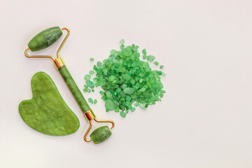 Facial massage jade roller and sea green aroma salt.