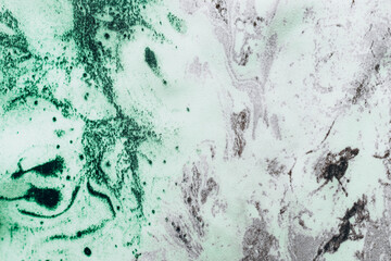 Fabric texture green with white natural silk marble print, tie-dye technique.