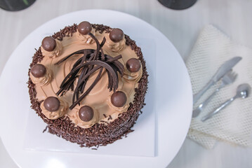 chocolate cake with chocolate chunks on baking sheet.
