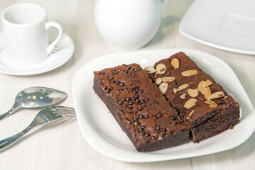 Chocolate brownies on sackcloth and coffee beans