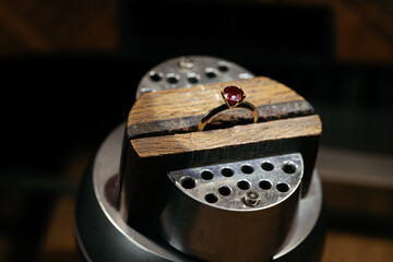 Craft jewelery making with professional tools. Ring repairing. Putting the diamond on the ring....