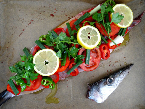 Ready to grill European barracuda (locally known as iskarmoz, known also as mediterranean barracuda, Sphyraena sphyraena) dish prepared with vegetables in Bodrum, Turkey.              