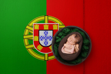 Newborn portrait on background in color of national flag. Patriotic photography concept. Portugal