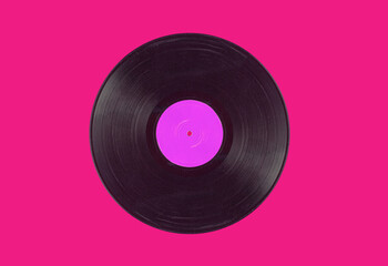 Vintage gramophone record on a bold color background. Retro music background, vinyl.