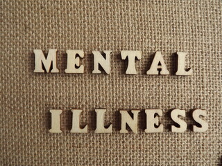 mental illness wooden letters and figurines of men and women. High quality photo